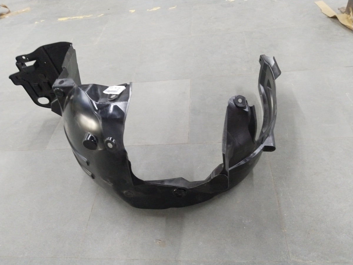 Honda Brio left front inner fender assembly, part #74150T08K00, showing the detailed inner structure and mounting points.