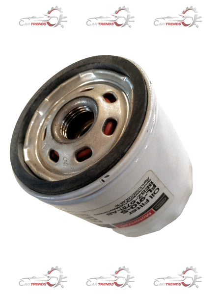 CarTrends Ford oil filter BE8Z6731AC, close-up view showing the cylindrical metal filter with threading for installation.