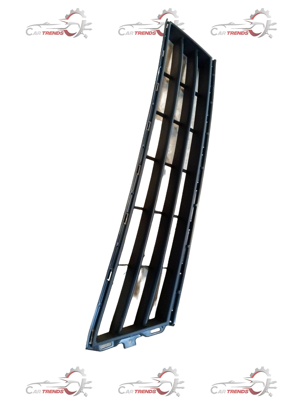 Maruti Suzuki Ertiga radiator grille showing a close-up of the black plastic grille with chrome accents.