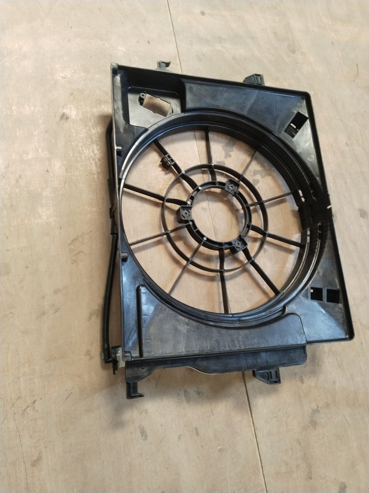 Hyundai I20 Active fan shroud part, black plastic component with mounting points, designed for engine cooling system.