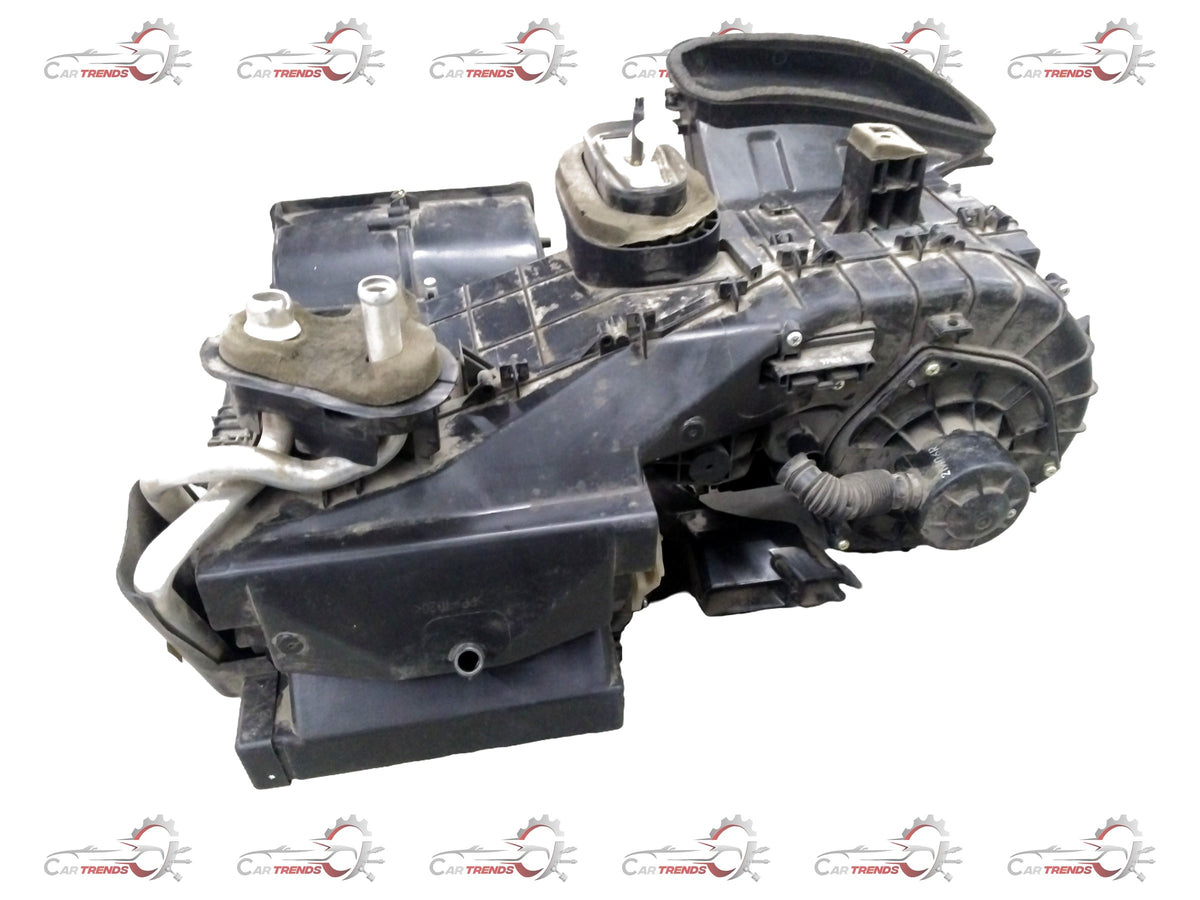 General Motors Chevrolet Beat air conditioning evaporator module assembly with heater, shown in a detailed view.