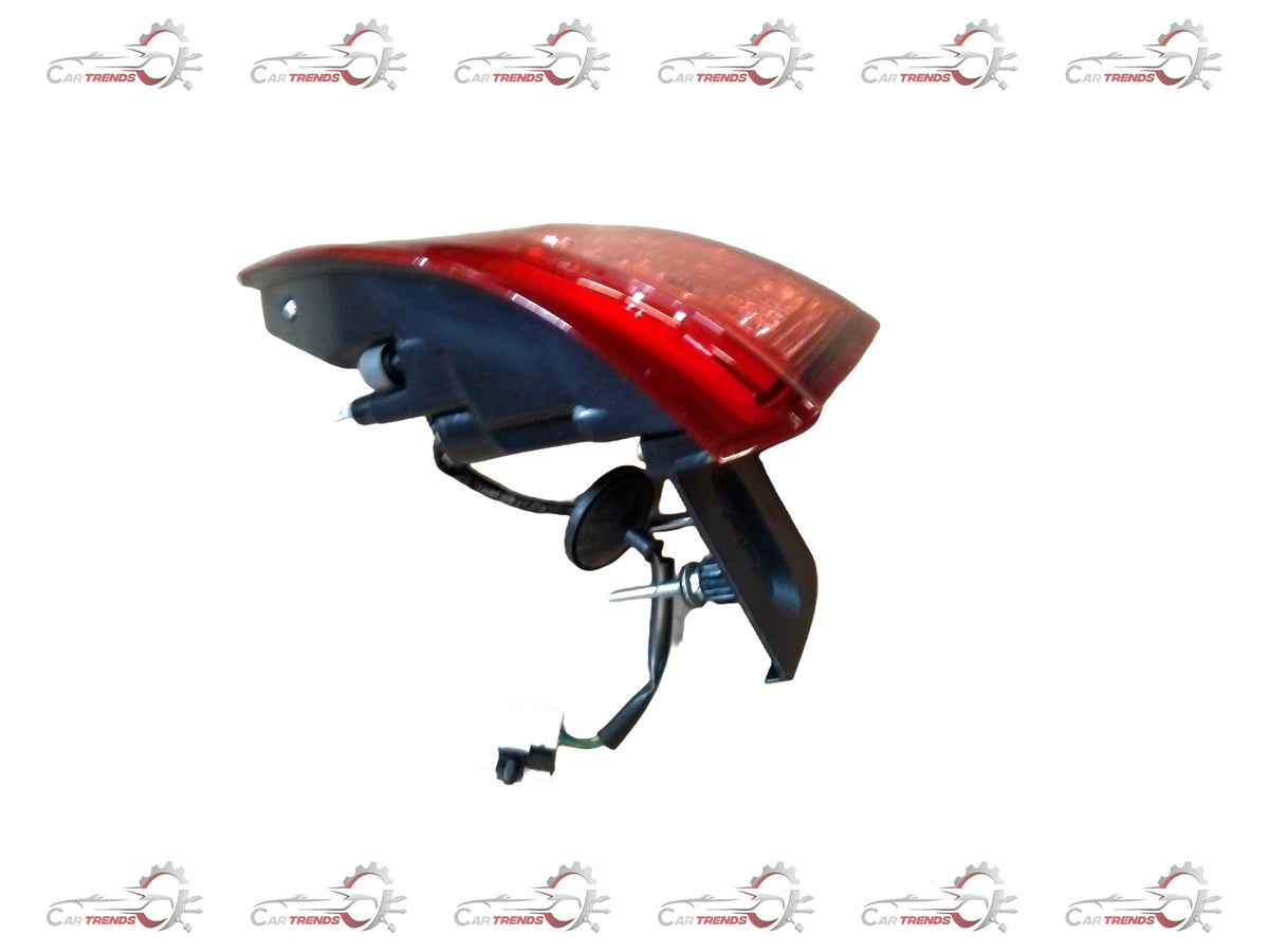 CarTrends Tiago/Tigor rear left tail light, close-up view showing red and clear lens sections for vehicle lighting.