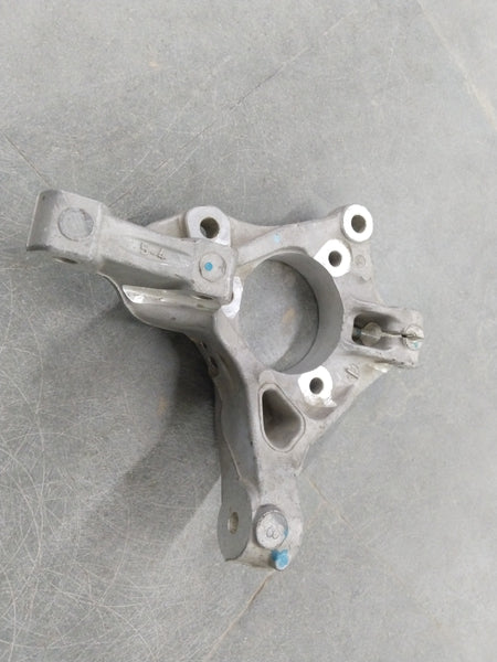 Image of a Chevrolet Cruze steering knuckle from General Motors, showing the metal component with mounting points and hardware.
