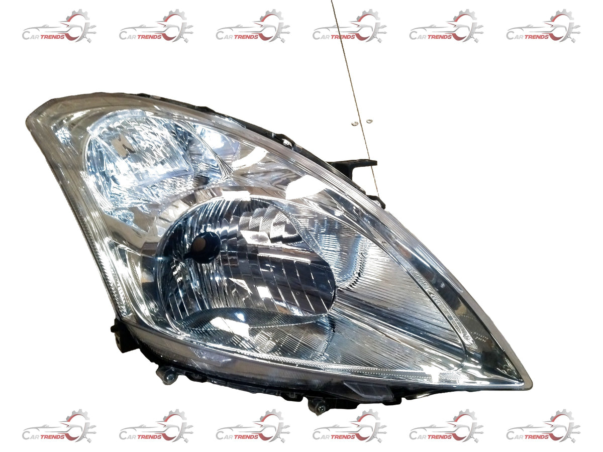 CarTrends Swift Dzire head lamp spare part, right-hand side, close-up view showing reflective surface and mounting points.