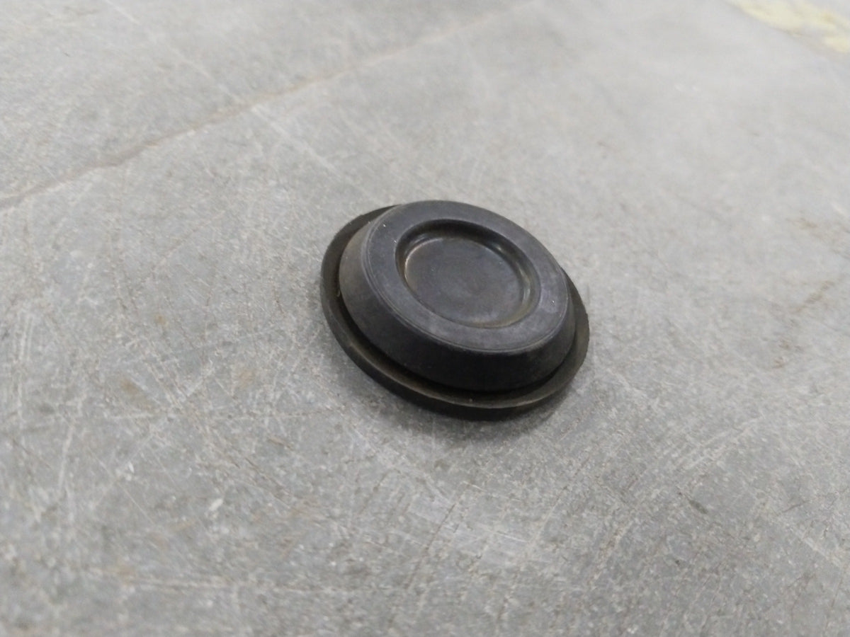 Chevrolet Optra engine plug by General Motors, showing the black plastic component with metal contacts for engine connection.