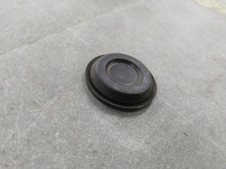 Chevrolet Optra engine plug by General Motors, showing the black plastic component with metal contacts for engine connection.