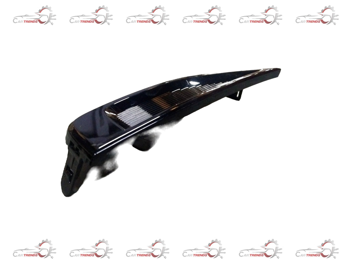 Front headlamp bezel for Maruti Suzuki, left side, close-up view showing the black plastic trim and mounting details.