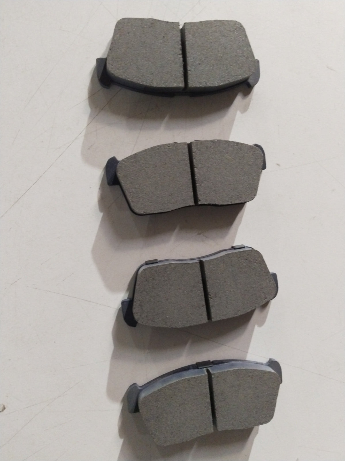 Front brake pad for Maruti Suzuki Eeco and Versa, all variants, showing the new brake pad with metal backing and friction surface.