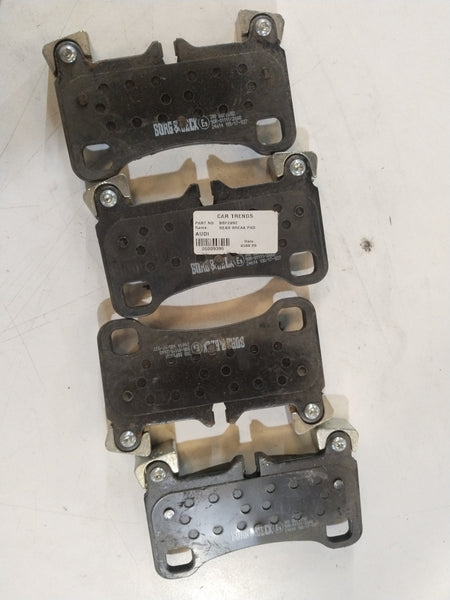Pair of aftermarket front brake pads for Audi Q7, showing the metal backing and brake friction surface.