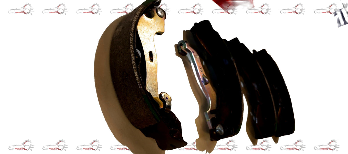 Pair of Tata brake shoe spare parts with metal backing and friction surface for vehicle braking system.