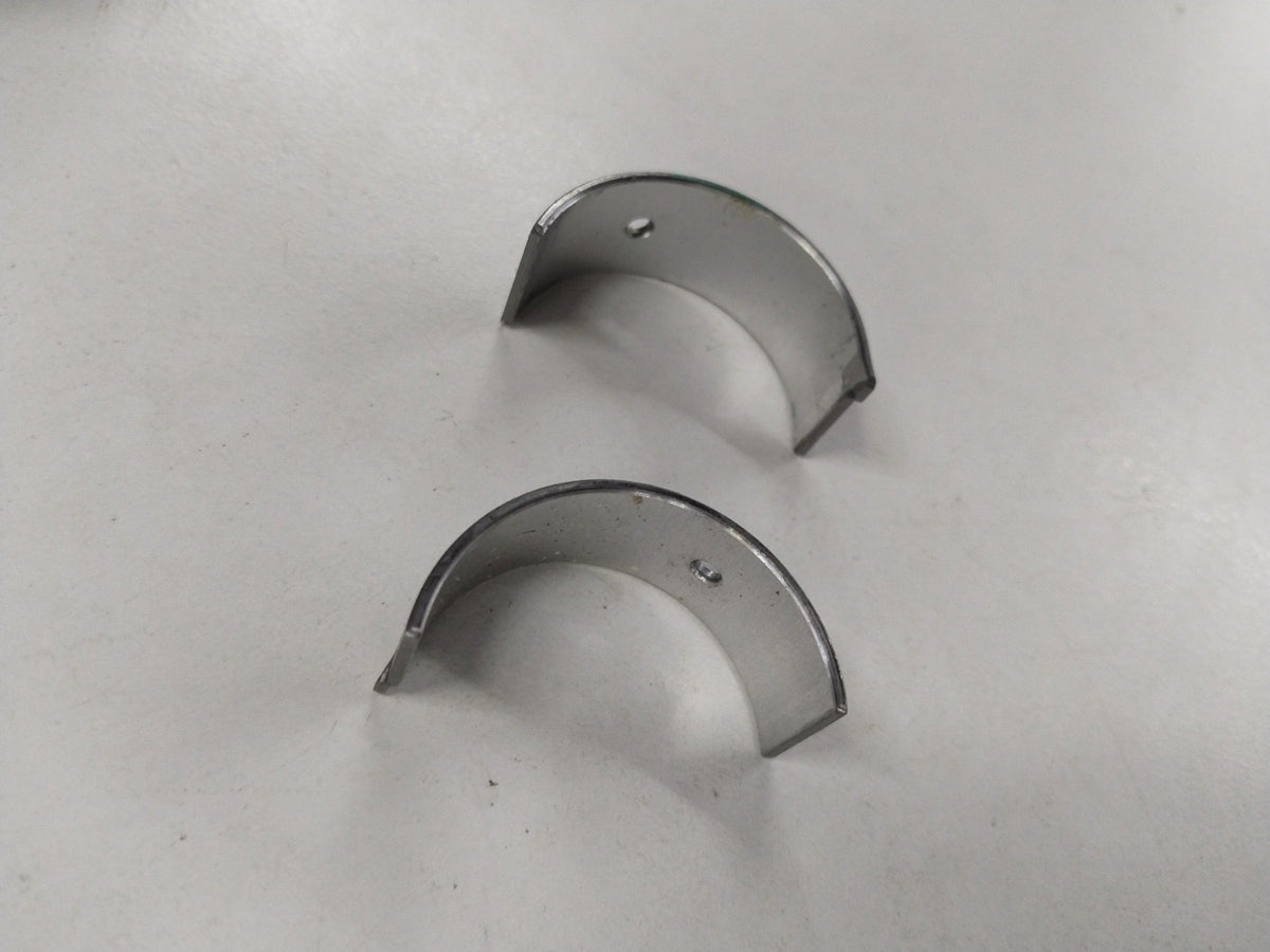 Chevrolet Aveo bearing connecting rod, general motors part, showing the metal component with detailed surface texture.