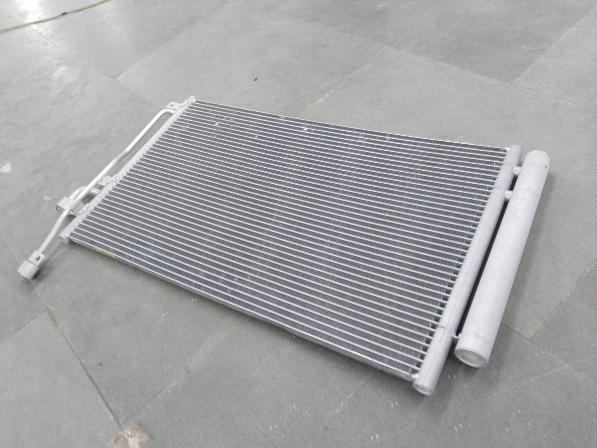 General Motors Chevrolet Captiva AC condenser showing metal fins and connections for efficient cooling.