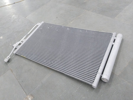 General Motors Chevrolet Captiva AC condenser showing metal fins and connections for efficient cooling.