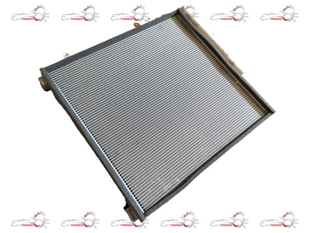 CarTrends AC condenser for Brezza 2nd Gen (2022+) petrol and CNG models, showing the metal core and fins in a close-up image.