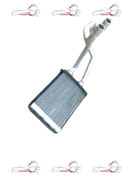 Maruti Suzuki heater core for S-Presso, showing the metal automotive part with inlet and outlet connections.