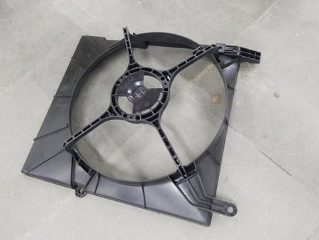 General Motors Chevrolet Aveo shroud part, showing close-up of black plastic exterior component with mounting points.
