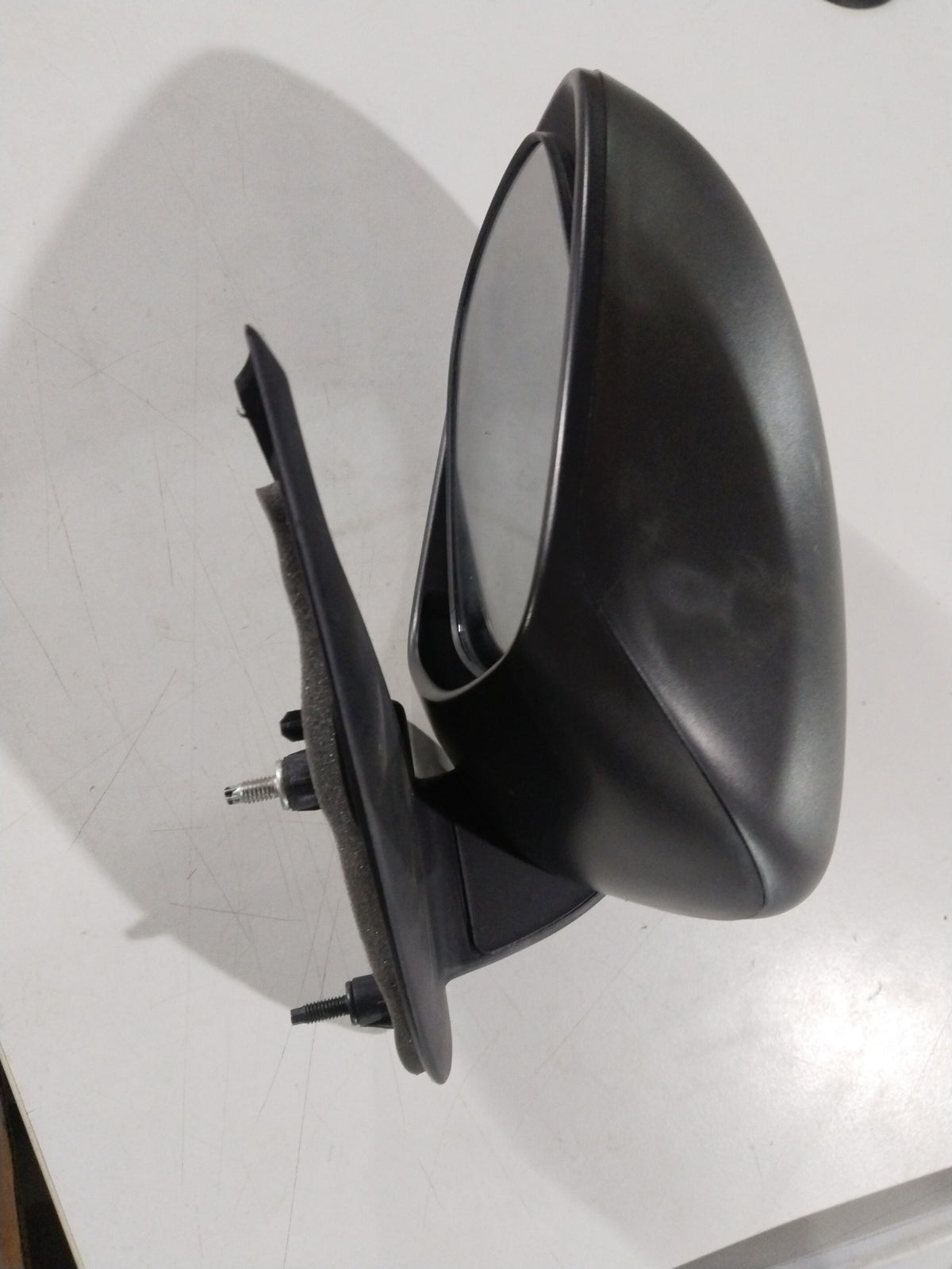 Left side mirror for Maruti Suzuki Swift and Dzire, model #84702M56R005PK, showing the mirror housing and reflective surface.