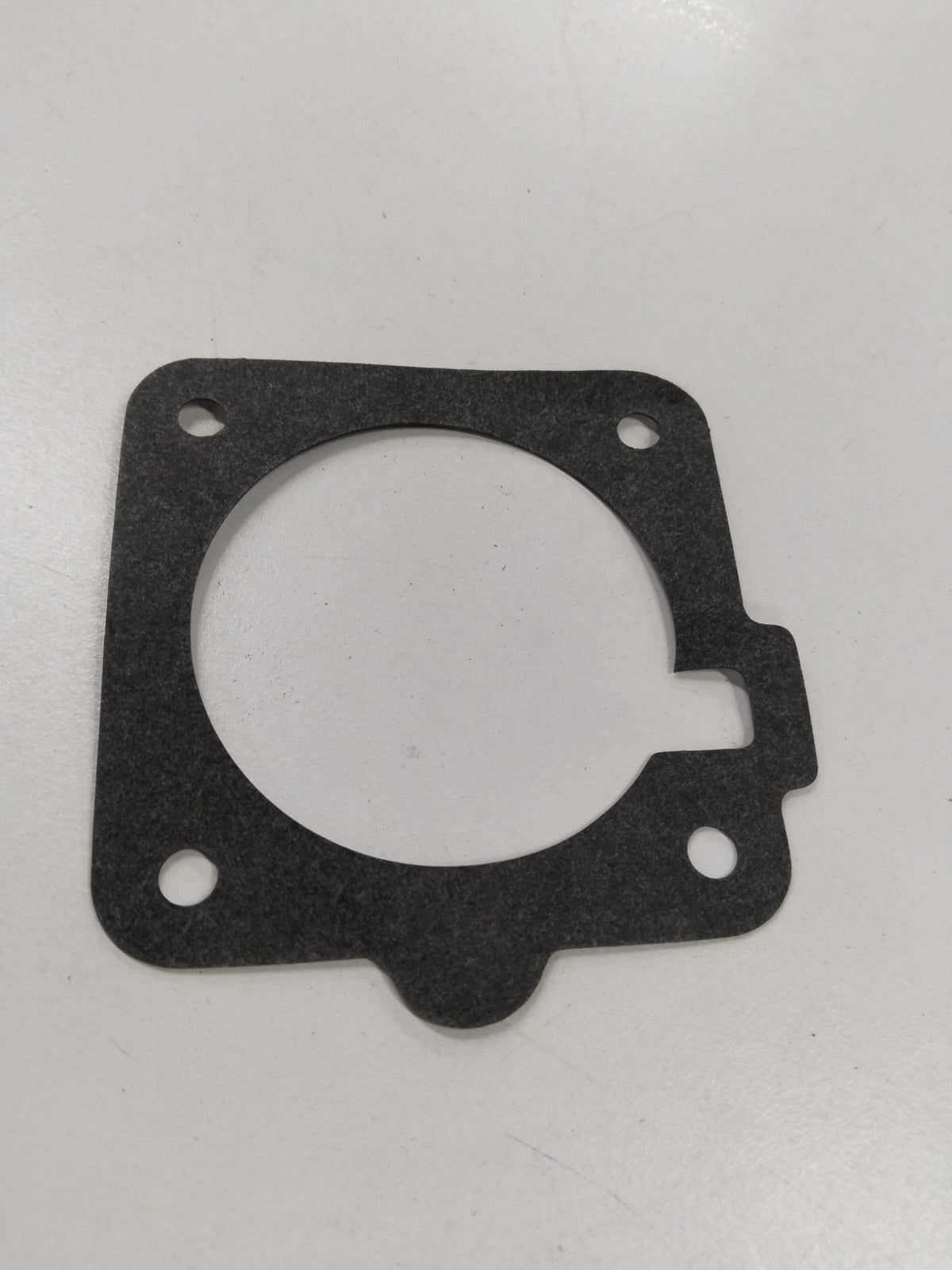 General Motors fuel injector gasket and meter body for Chevrolet Corsa, showing the detailed gasket and fuel meter components.