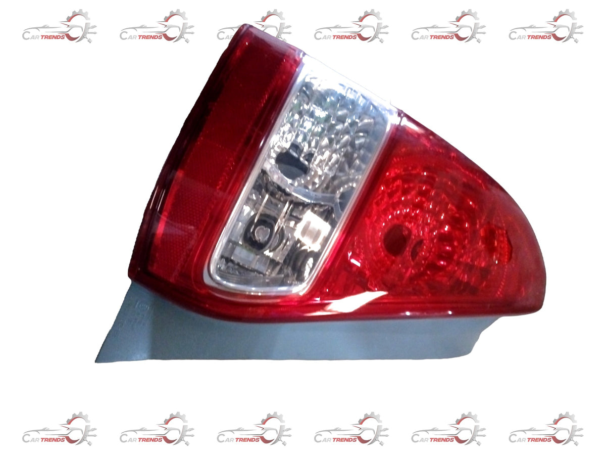 Toyota Yaris rear combination lens assembly, automotive tail light part with red and clear lens sections, for rear vehicle lighting.