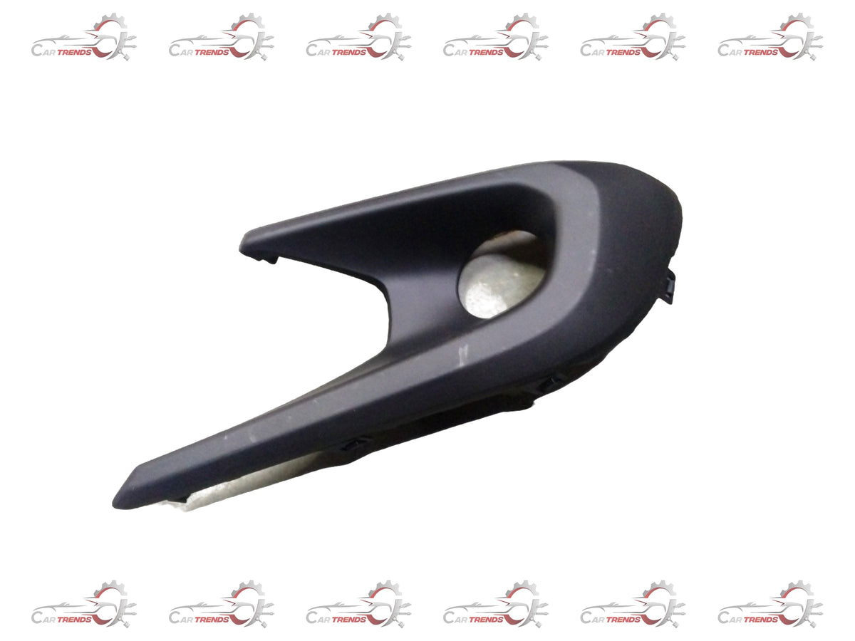 Front fog lamp bezel for Maruti Suzuki vehicle, showcasing the beige plastic frame designed for the left side of the car.