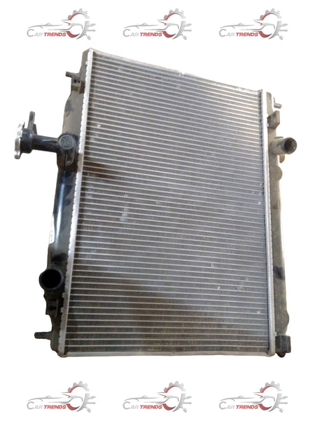 CarTrends Verna old model radiator assembly, petrol spare part with metal fins and mounting brackets, for car cooling system.
