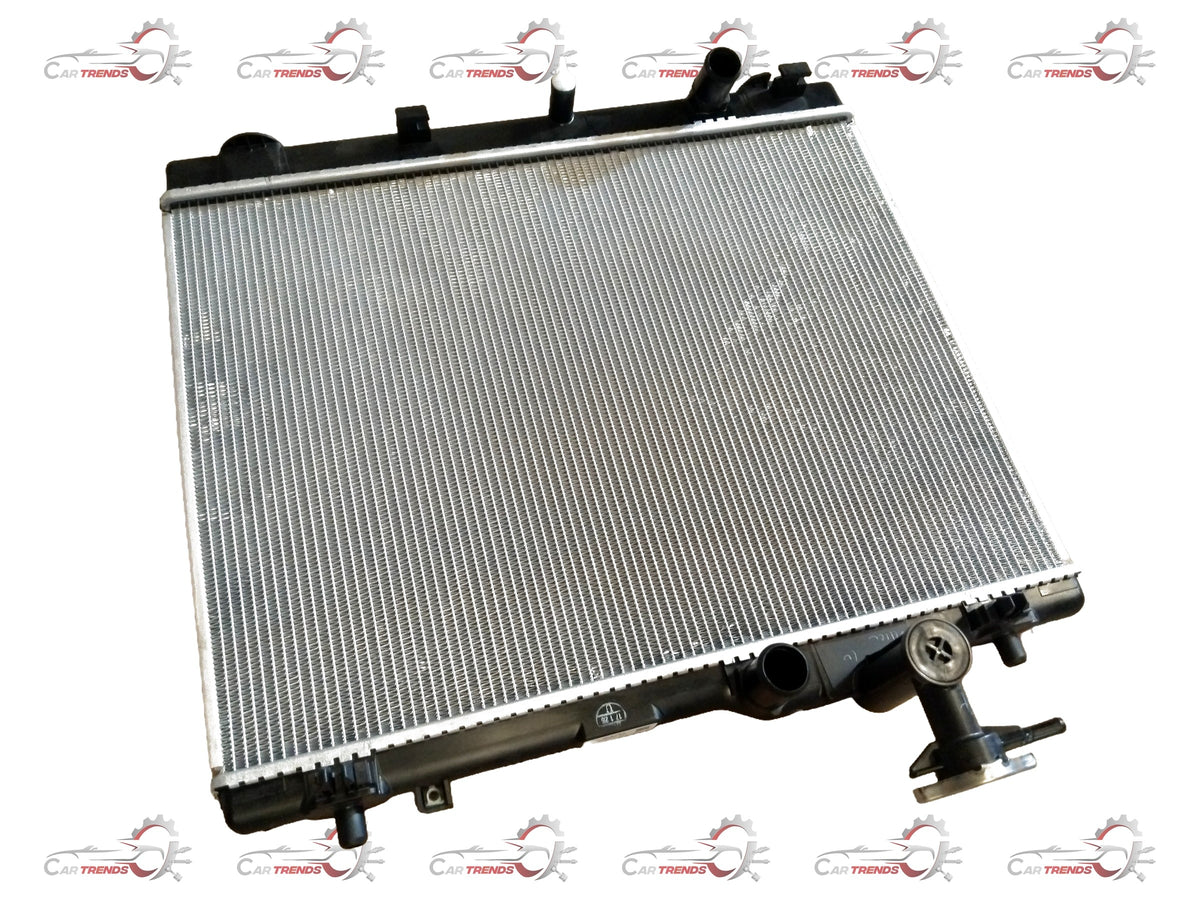 Maruti Suzuki 2nd Gen Swift radiator for petrol and diesel models, part number 17700M83P00, showing the metal core and inlet/outlet ports.