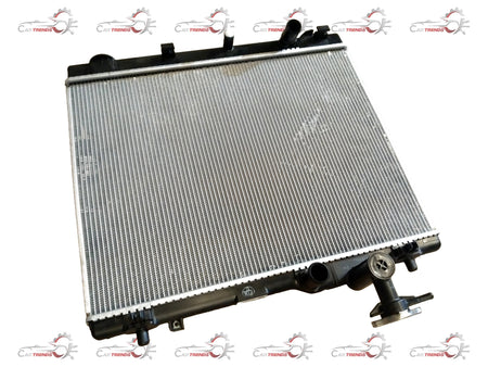 Maruti Suzuki 2nd Gen Swift radiator for petrol and diesel models, part number 17700M83P00, showing the metal core and inlet/outlet ports.