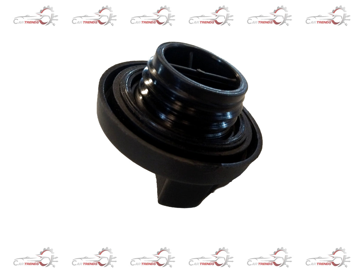 Maruti Suzuki oil filler cap, metallic with black plastic top, designed for vehicle engine oil fill port, shown in close-up image.
