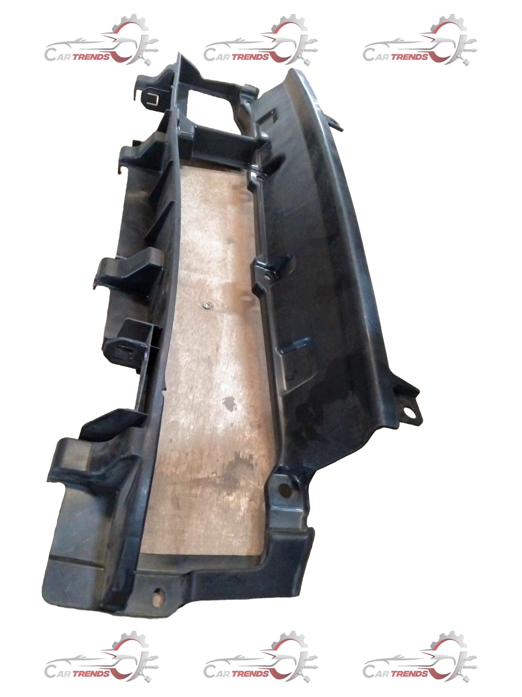 Maruti Suzuki front lower bumper cover part 72433M73R10, showing the exterior front end component with mounting points and finish.