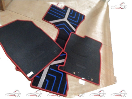 Red Honda floor mat designed for City, Amaze, Elevate, and WR-V models, shown in a close-up view of its textured surface.