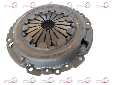 Tata Indica Xeta clutch and pressure plate kit showing metal clutch components and pressure plate assembly in a natural setting.
