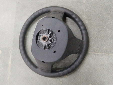 General Motors Chevrolet Enjoy steering wheel assembly with visible spokes and central hub for vehicle control.