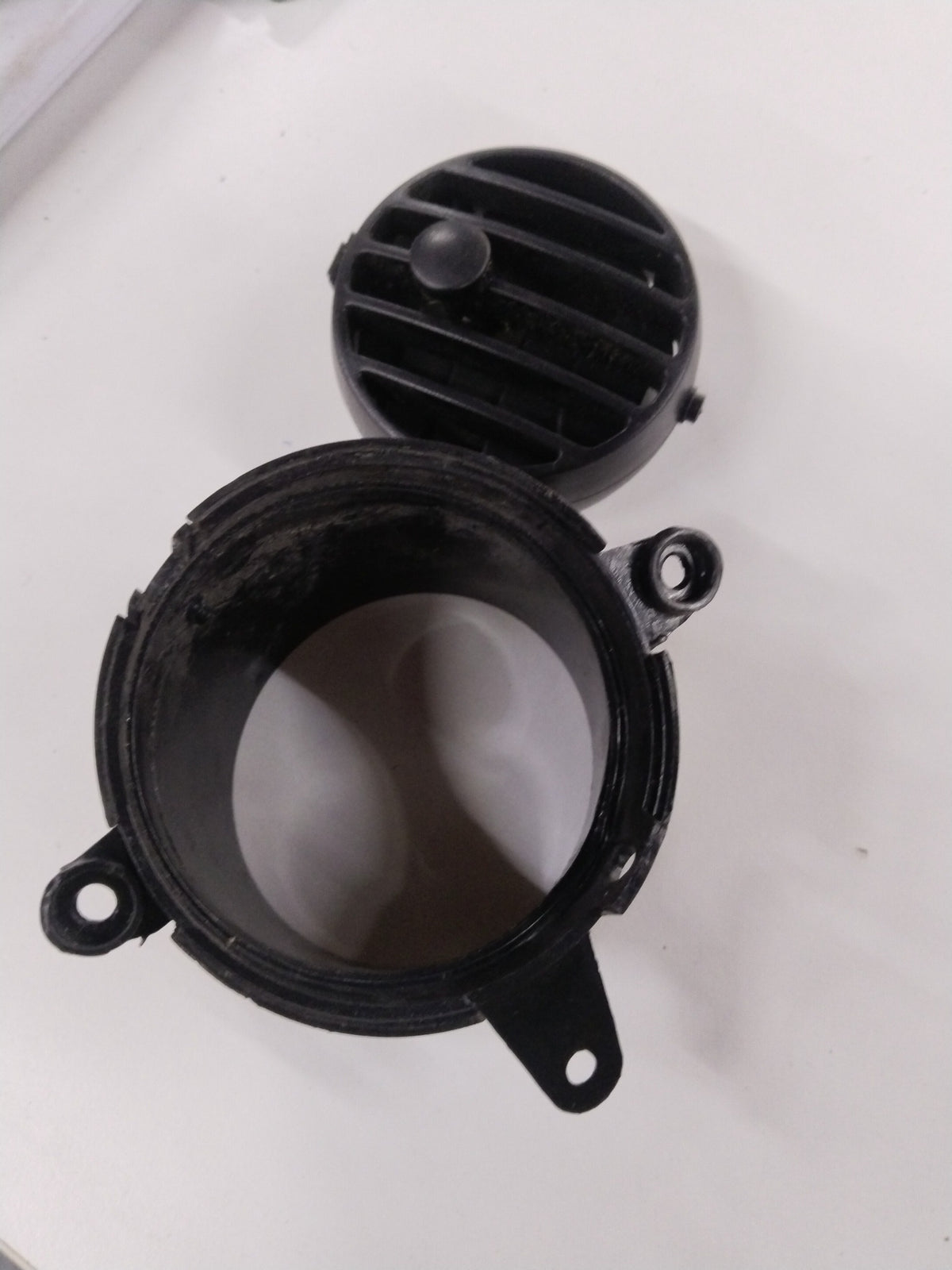 Chevrolet Tavera door inlet part by General Motors, shown in a close-up image highlighting the component details.