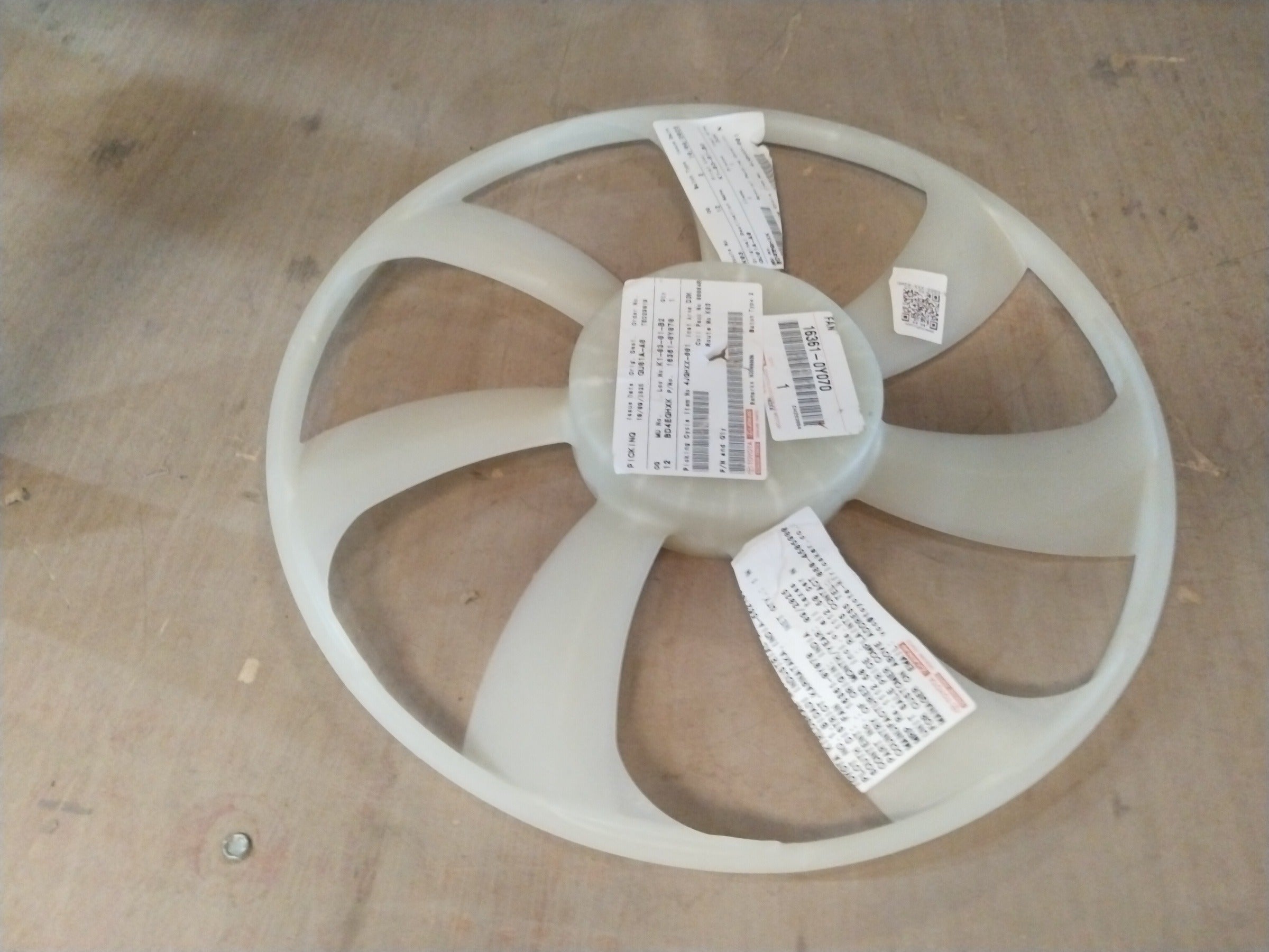 Toyota fan for Innova, Fortuner, Glanza, and Hyryder models, showing the metal blades and mounting frame.
