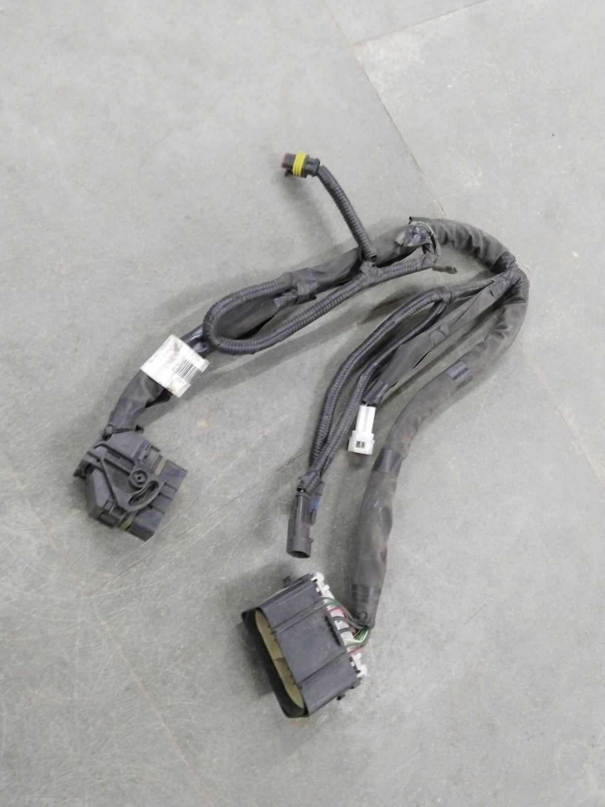 Chevrolet Aveo wiring harness engine patch by General Motors, showing close-up of the electrical connector and wiring details.