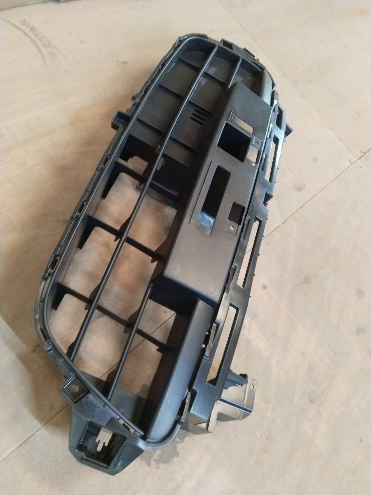 Maruti Suzuki Alto K10 bumper grill, lower front replacement part, with black finish and mounting details visible in the image.