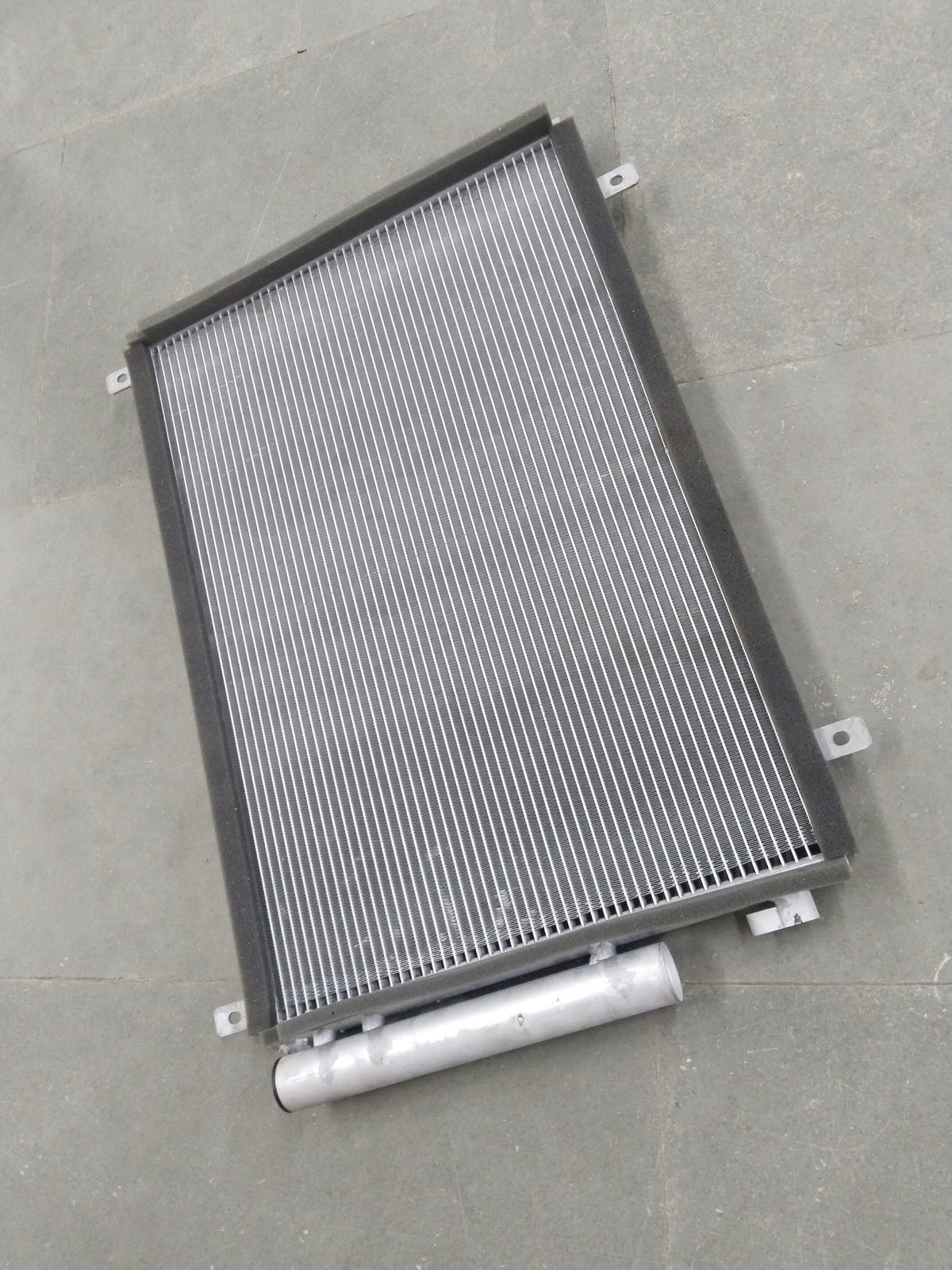 CarTrends Swift Deizre Type 3 condenser with multiple variants, showing close-up of the metal fins and connection points.