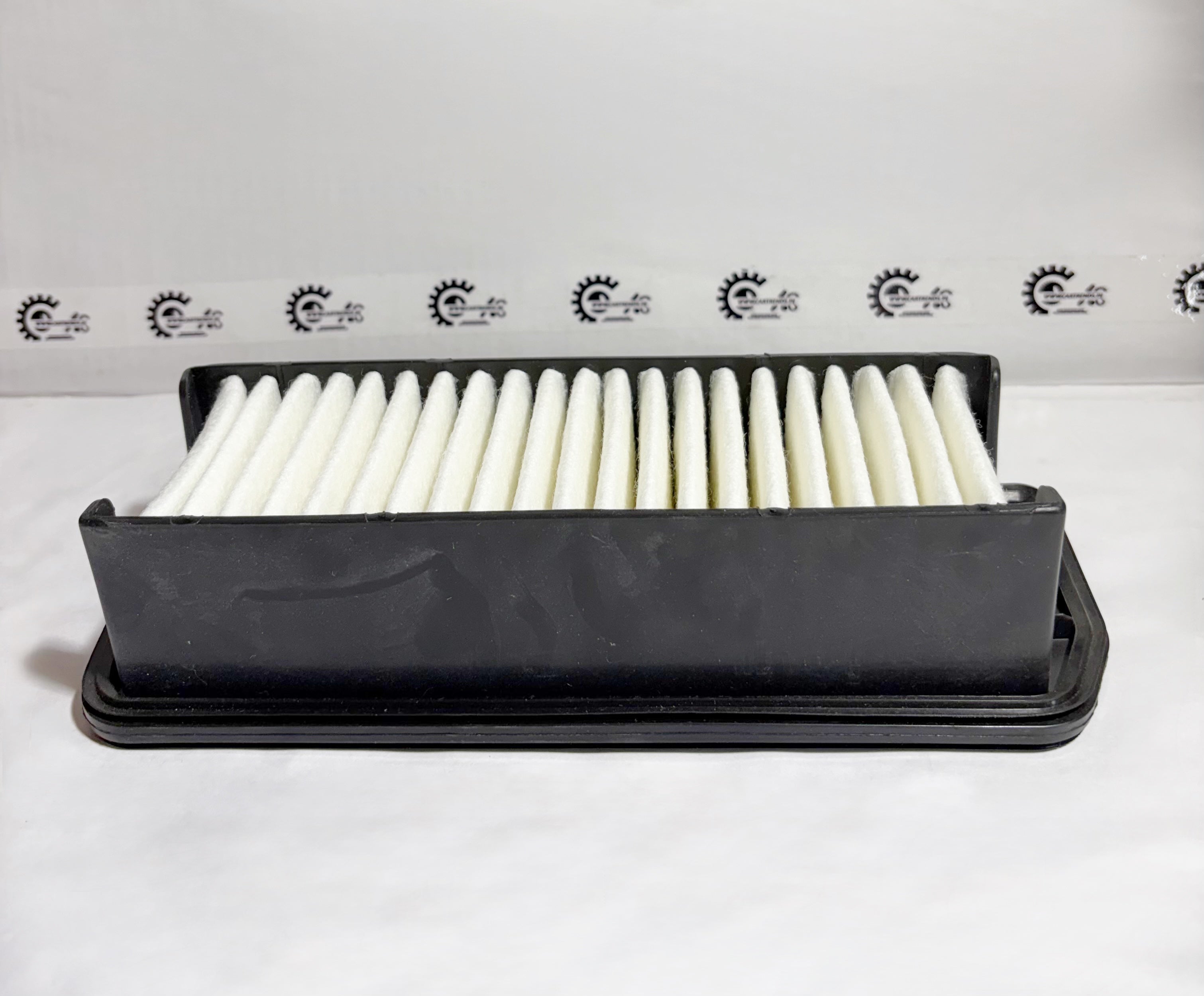Maruti Suzuki air filter for Alto K10 model, part number 13780M65L00, shown from the back view, for engine air filtration.