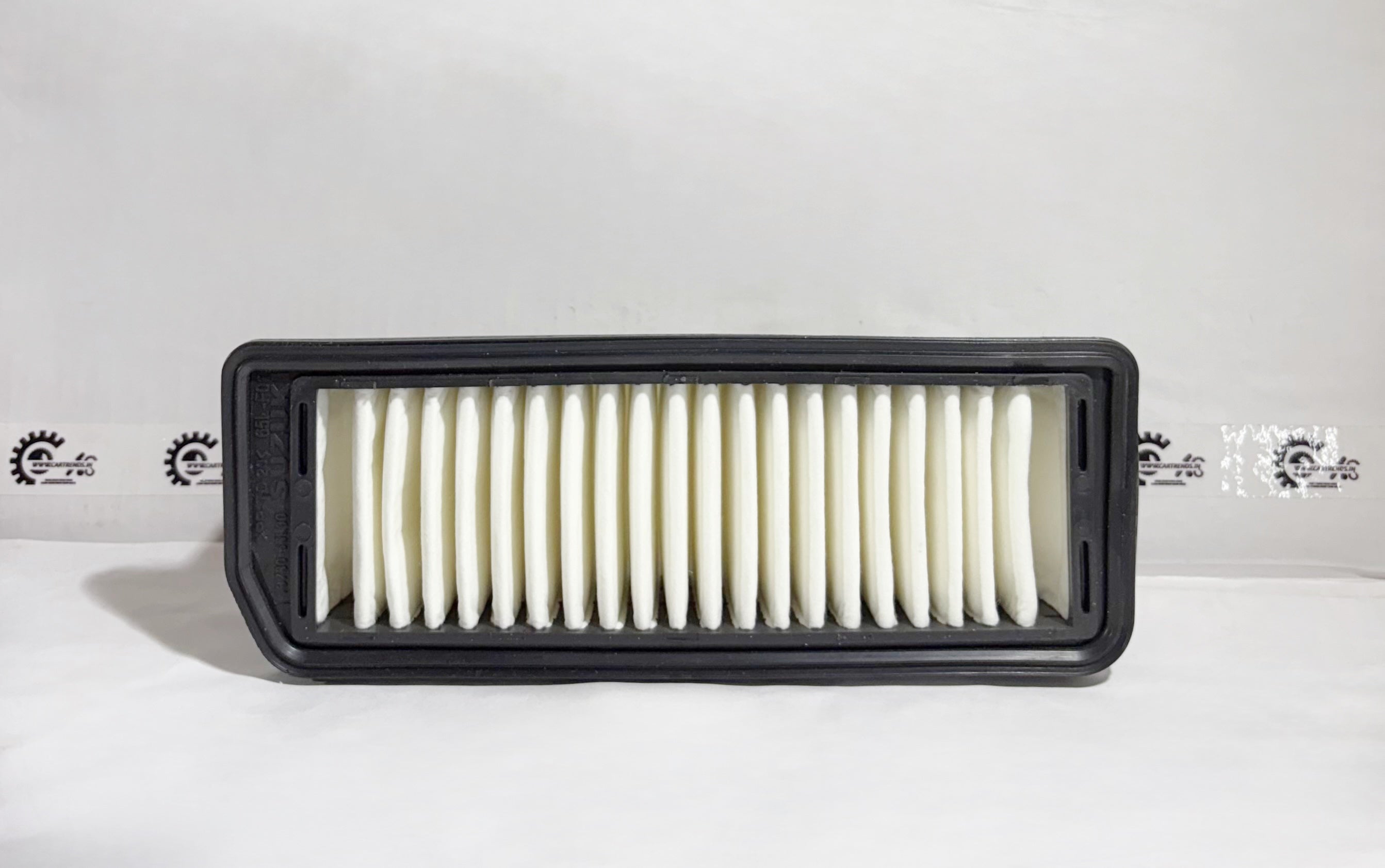 Maruti Suzuki Elementair Cleaner air filter for Alto K10, front view, replacement part 13780M65L00, vehicle maintenance component