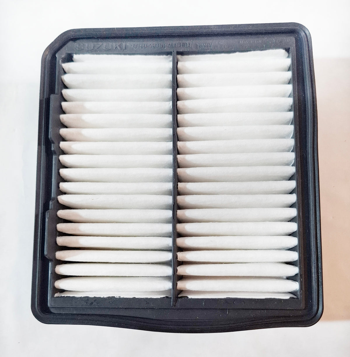 Maruti Suzuki air filter for Eeco model, showcasing the clean, rectangular filter element with visible pleats.