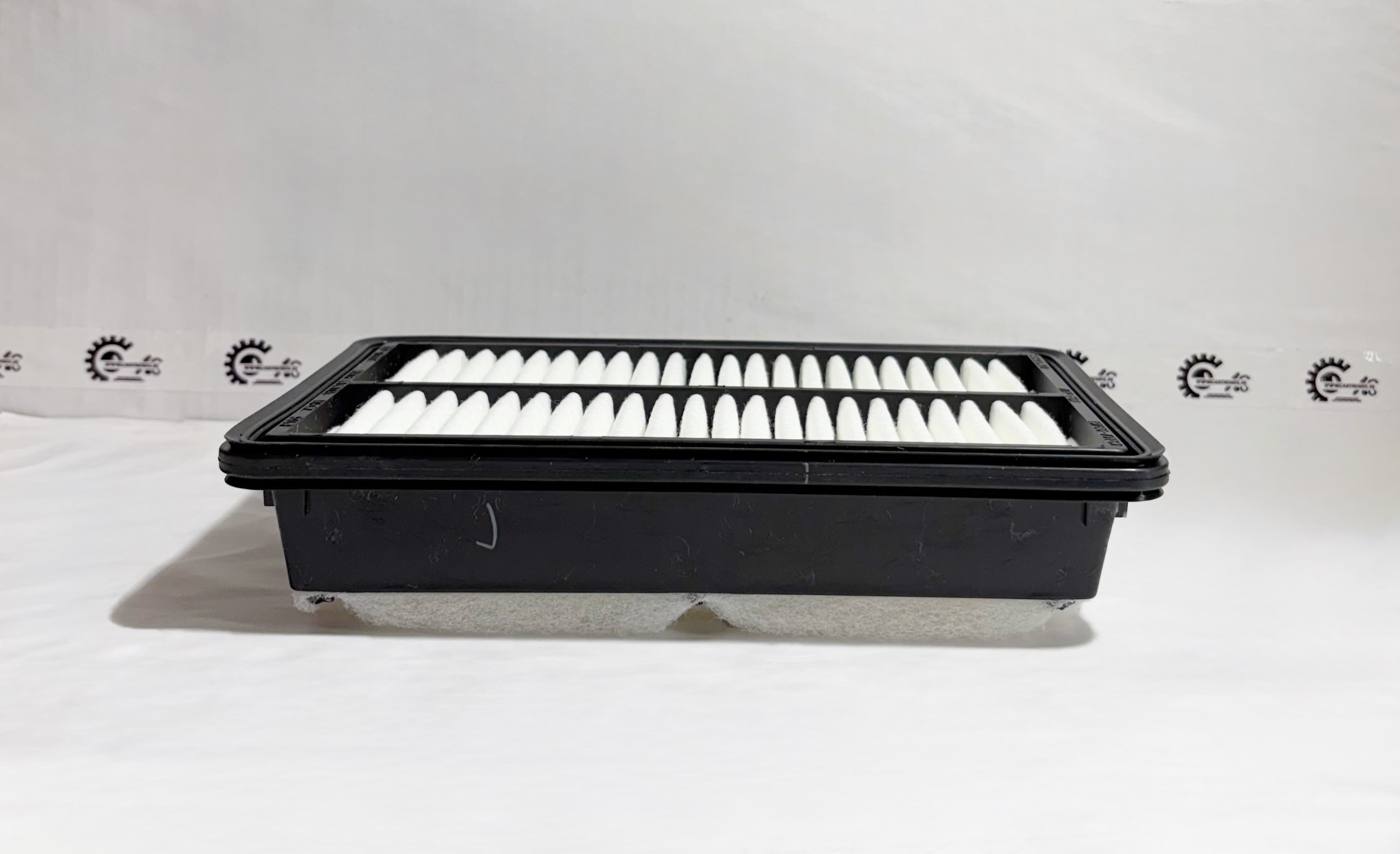 Maruti Suzuki Element Air Cleaner filter for Super Carry, shown from the left side, designed to improve engine air intake.