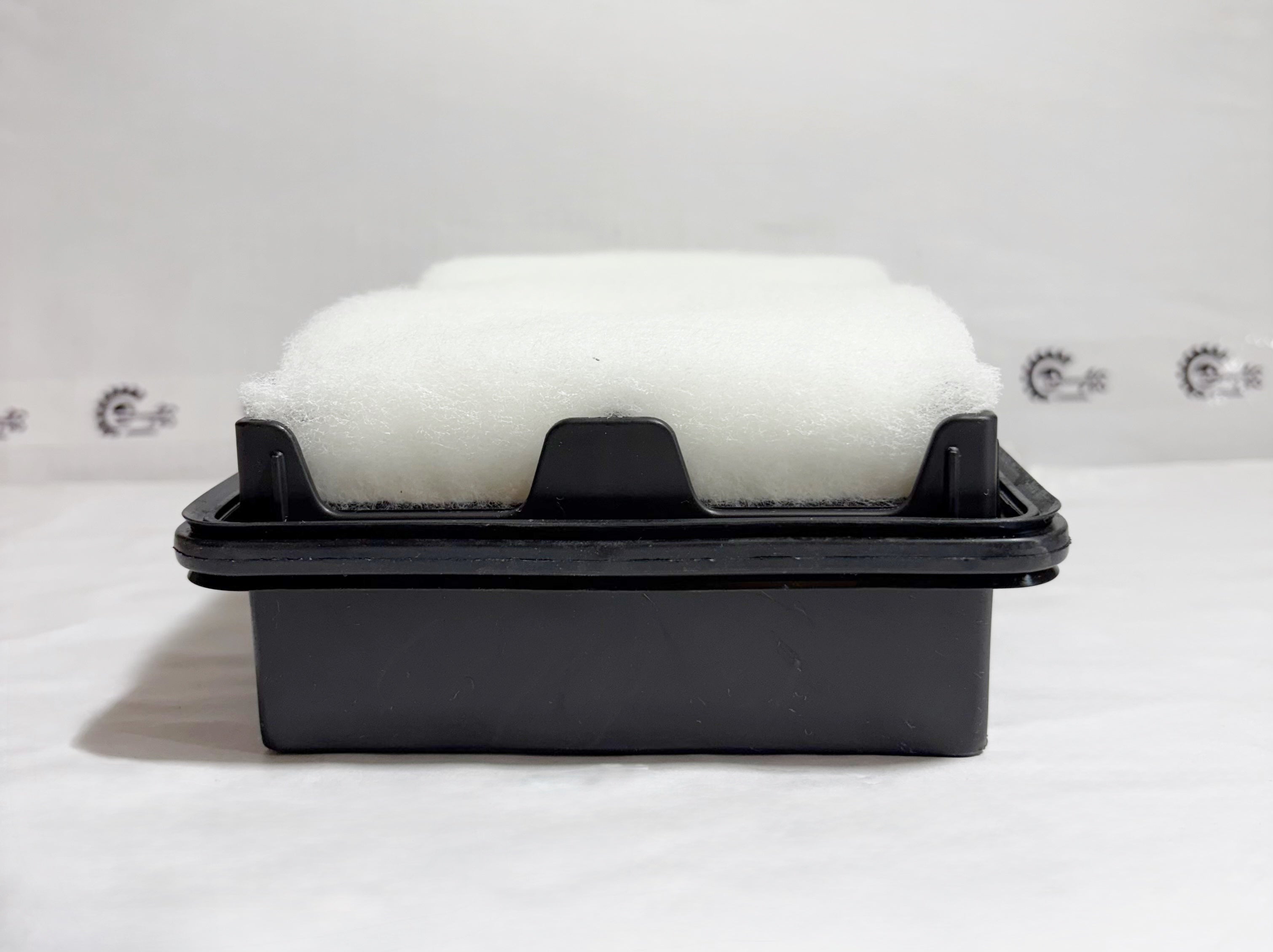 Maruti Suzuki Super Carry air filter with model 13780M77PA0, shown from the back, designed for vehicle air filtration.