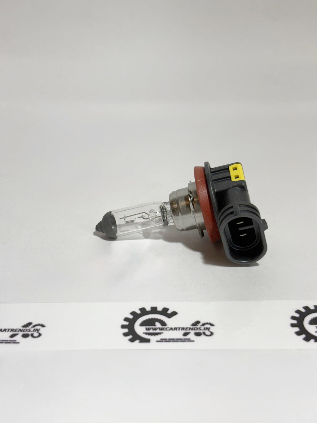 Honda BULB H8(LL) 33165TL0003 headlight bulb installed in the left side of a Honda vehicle.