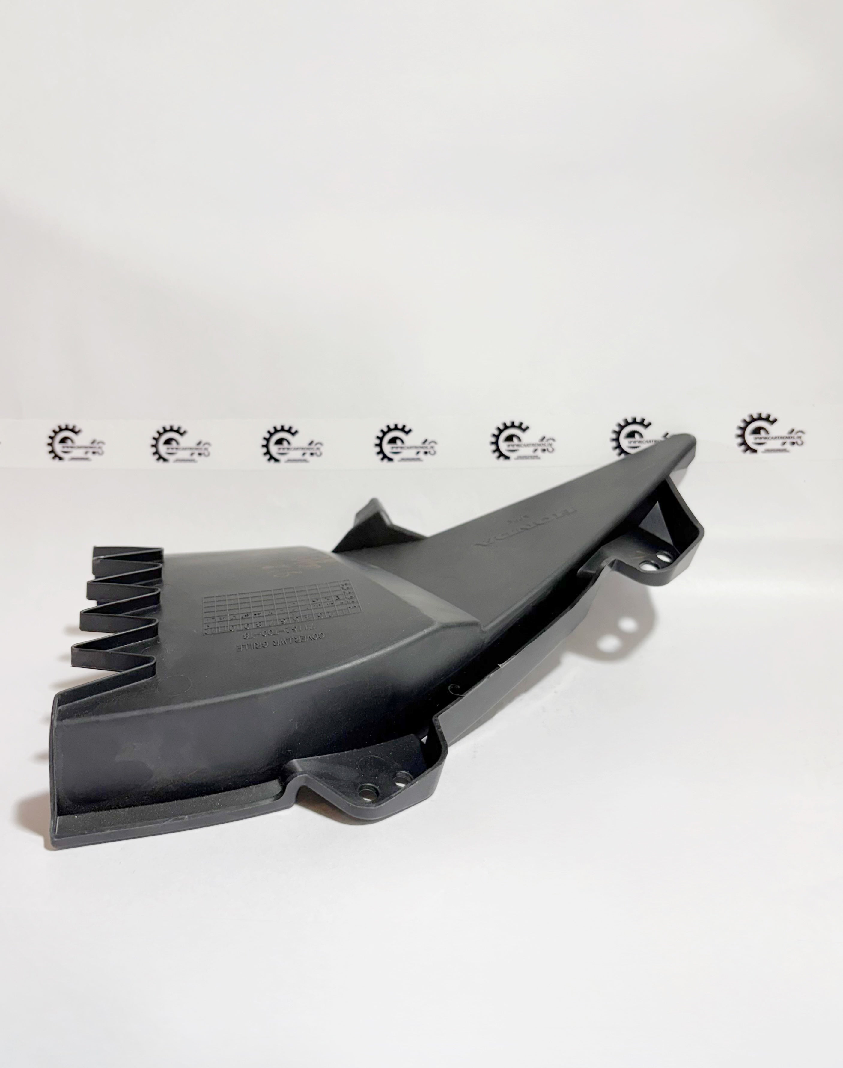 Honda COVER.LWR GRILLE 71152T00T80 left side, close-up of the lower grille cover for Honda vehicle.