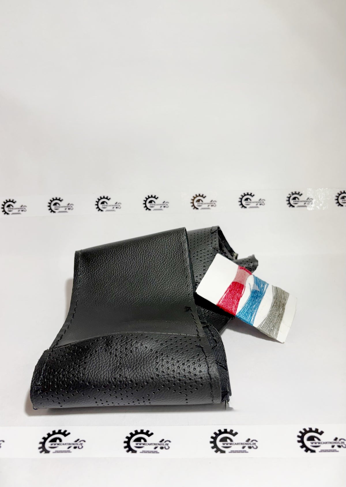 Honda steering wheel cover kit, 08U9831X700, front view showing textured black material for a secure grip and stylish look.