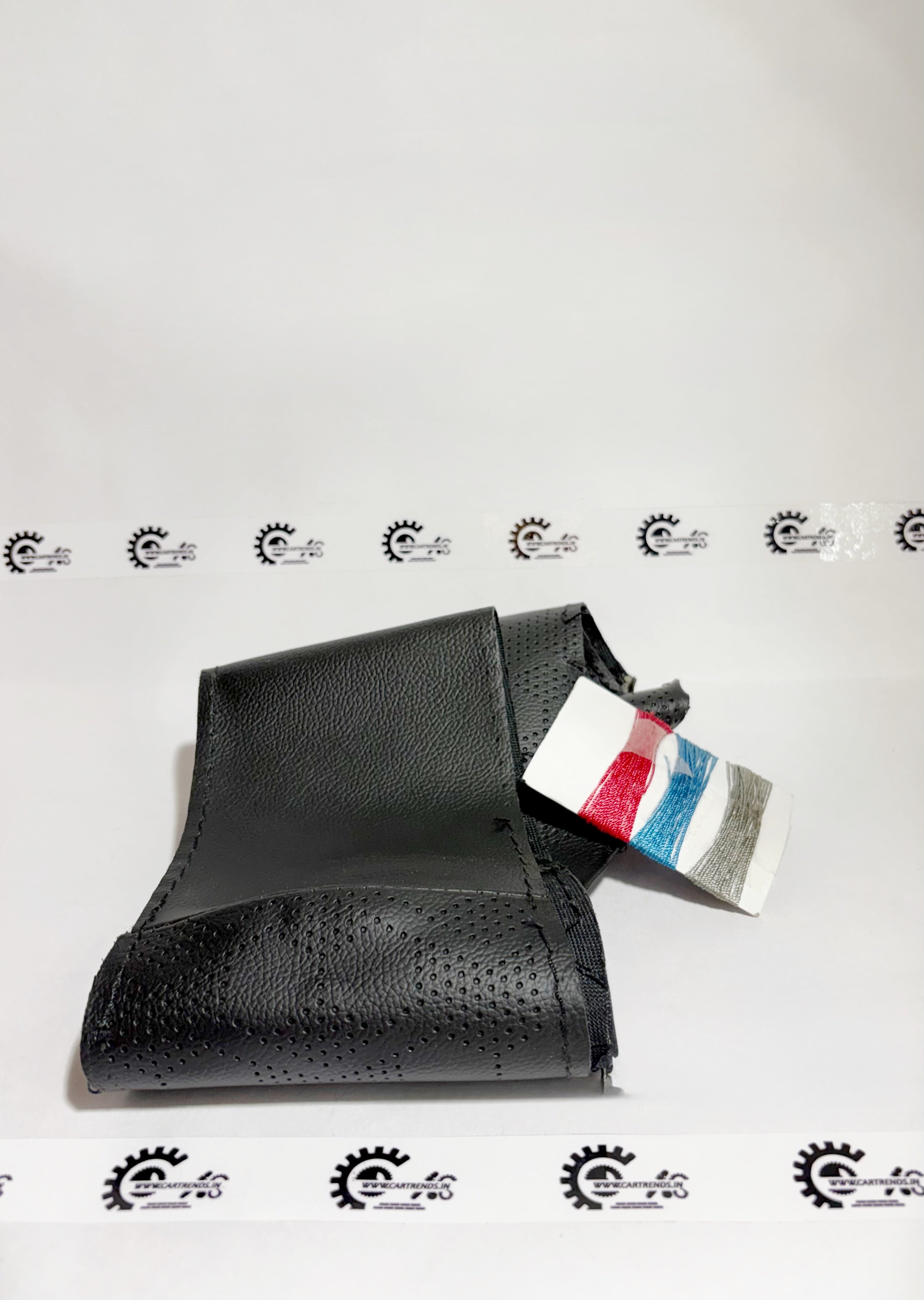 Honda steering wheel cover kit, 08U9831X700, front view showing textured black material for a secure grip and stylish look.