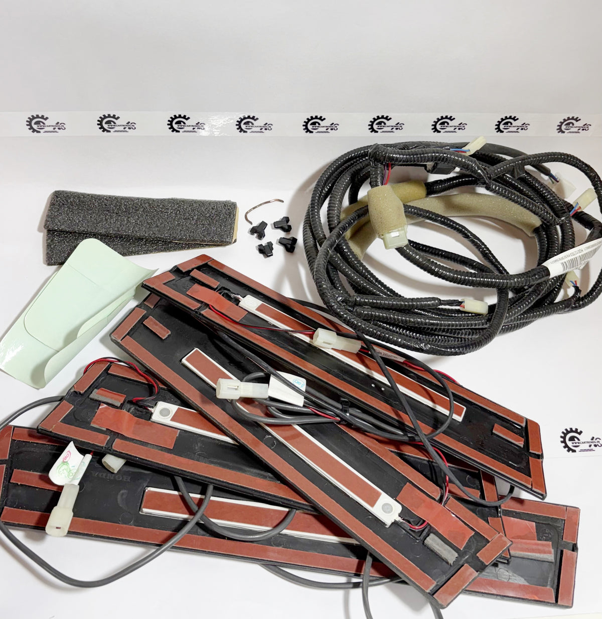 Honda KIT STEP ILLUMINATION with four lights, showing the installed LED lighting for vehicle step area in a close-up view.