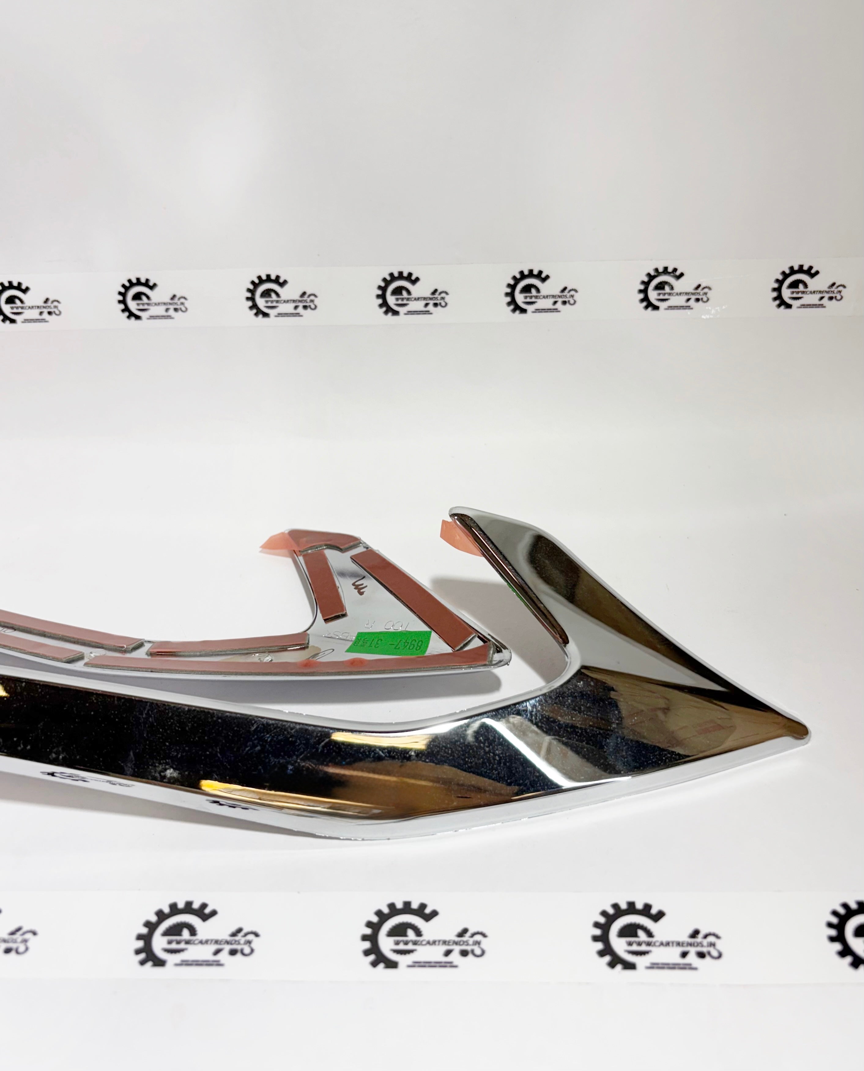 Honda tail lamp garnish kit, left side, for Honda vehicles, showcasing the sleek design and fit of the tail lamp trim piece.
