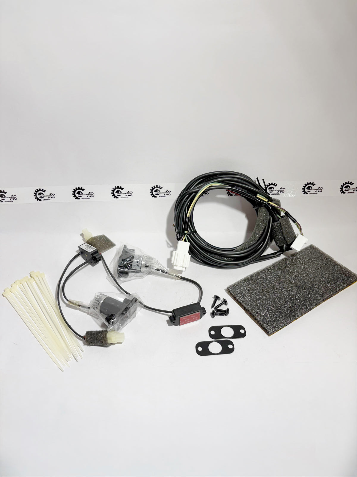 Honda WRV logo projector kit, showing the projector unit with branding, mounted on the vehicle's left side.