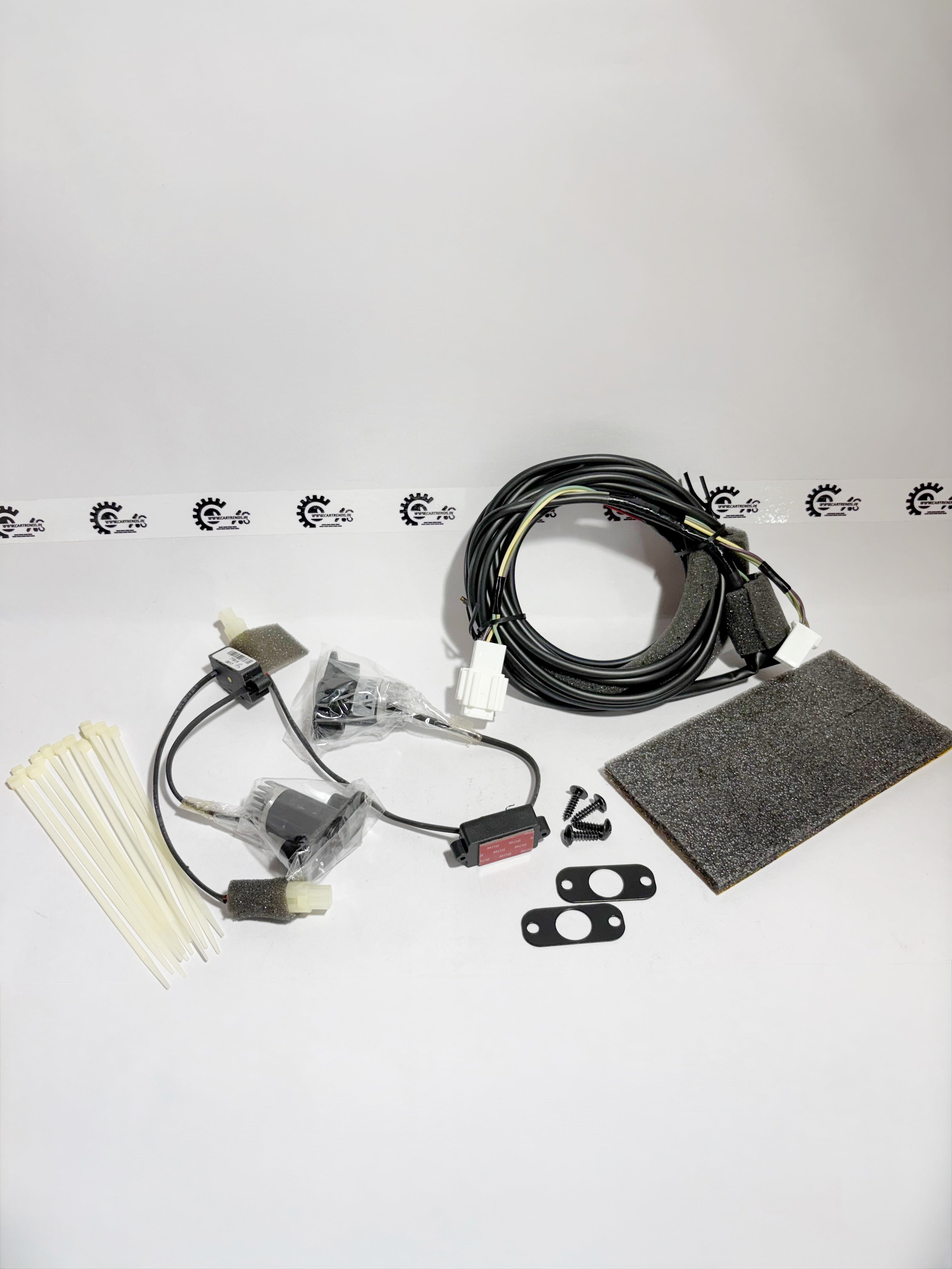 Honda WRV logo projector kit, showing the projector unit with branding, mounted on the vehicle's left side.